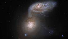 Две галактики с нового снимка «Хаббла» сливаются друг с другом