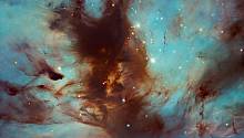 «Хаббл» зафиксировал светящиеся пылевые вихри туманности Пламя